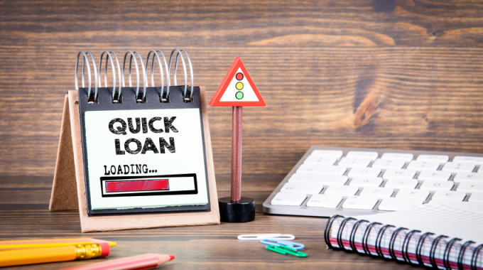 Quick Loan Sign on Wood Background - Unsecured Personal Loans for Bad Credit With Instant Decision