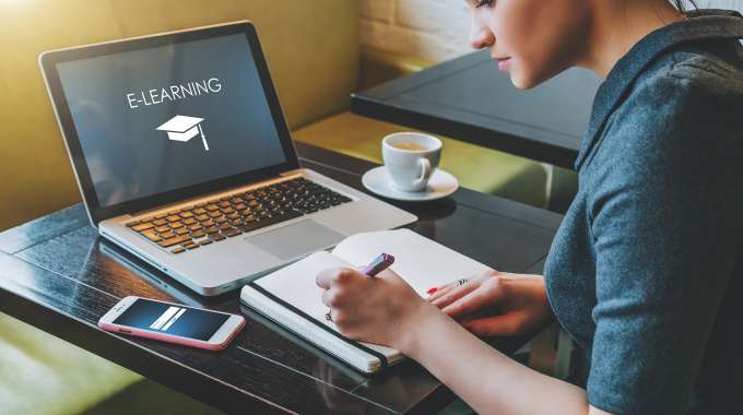 person doing free online courses at home