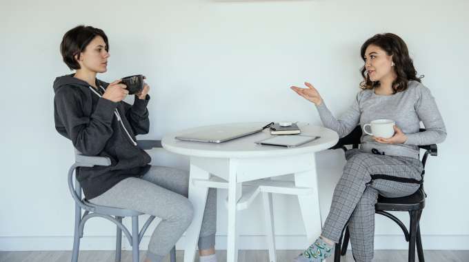 Two people discussing co-signer requirement