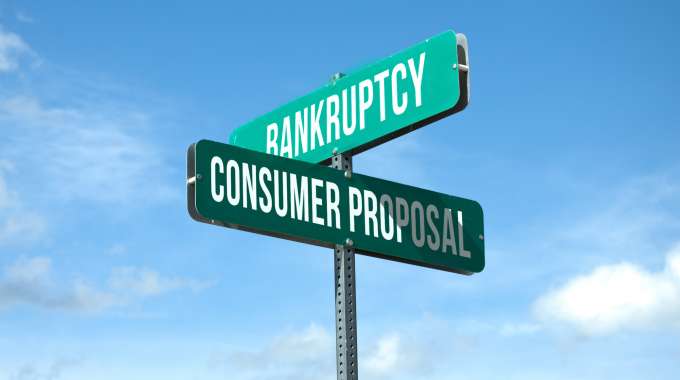 sign represents decision to be made: consumer proposal or bankruptcy