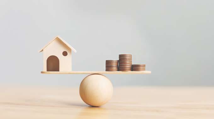seesaw balancing home equity loans and mortgage refinancing