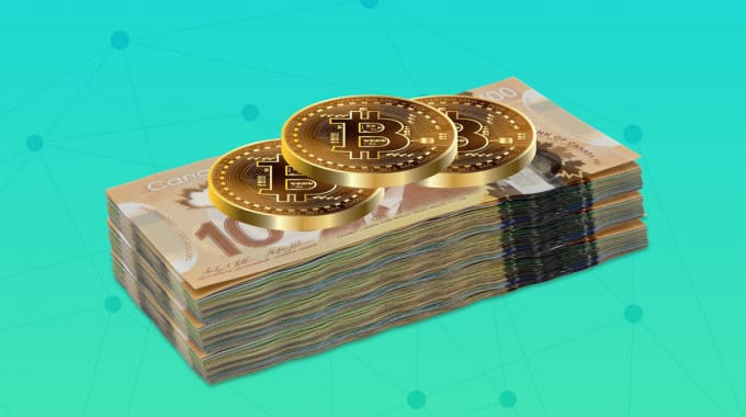 Bitcoin stacked on top of Canadian dollar currency
