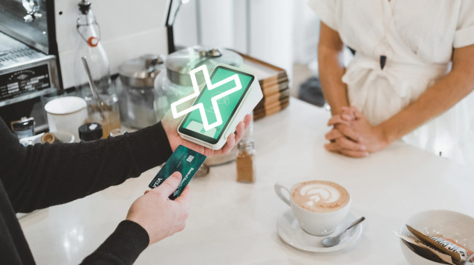 Person using a credit card instead of a debit card