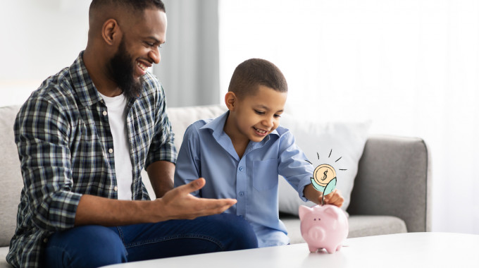 Child saving money in a piggy bank