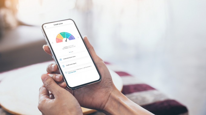 person checking their credit score on their credit score app