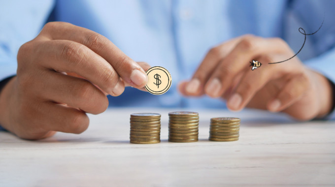 Coins and calculator belonging to person researching rrsp savings accounts