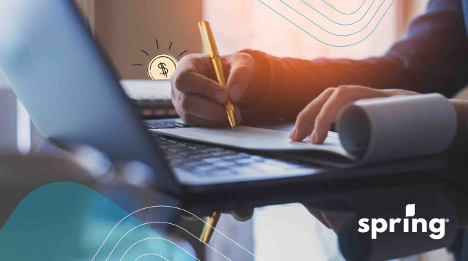 Writing a cheque at a table