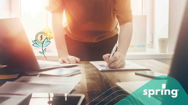 Man filling out self employment taxes in Canada