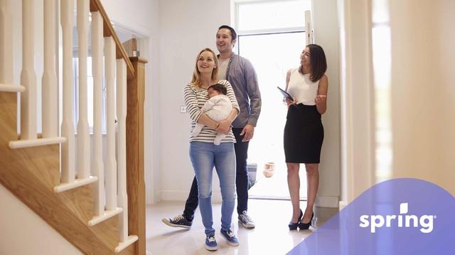 Couple looking at $300,000 house with real estate agent