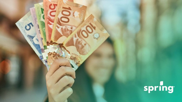 Woman showing BC income assistance amount