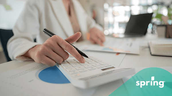 TFSA contribution limits - woman putting numbers into calculator